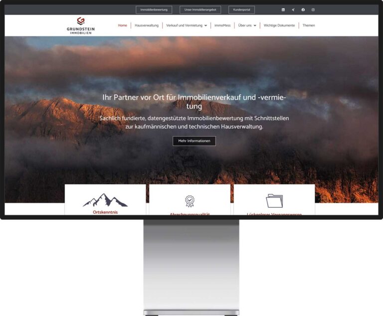 Monitor Mockup der Webseite Grundstein Immobilien by Immagine Werbeagentur und Webagentur München